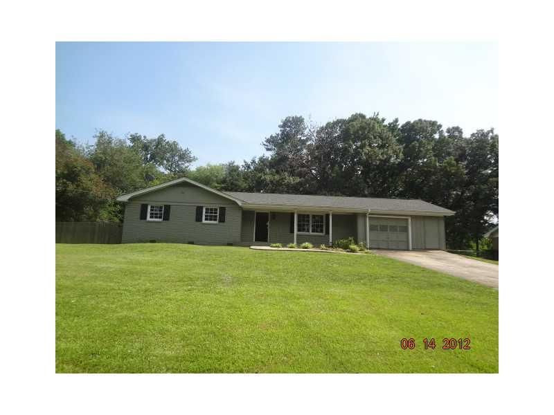 711 Ayres Road Mableton, GA 30126 - Photo 1 of 1 a front view of a house with a garden