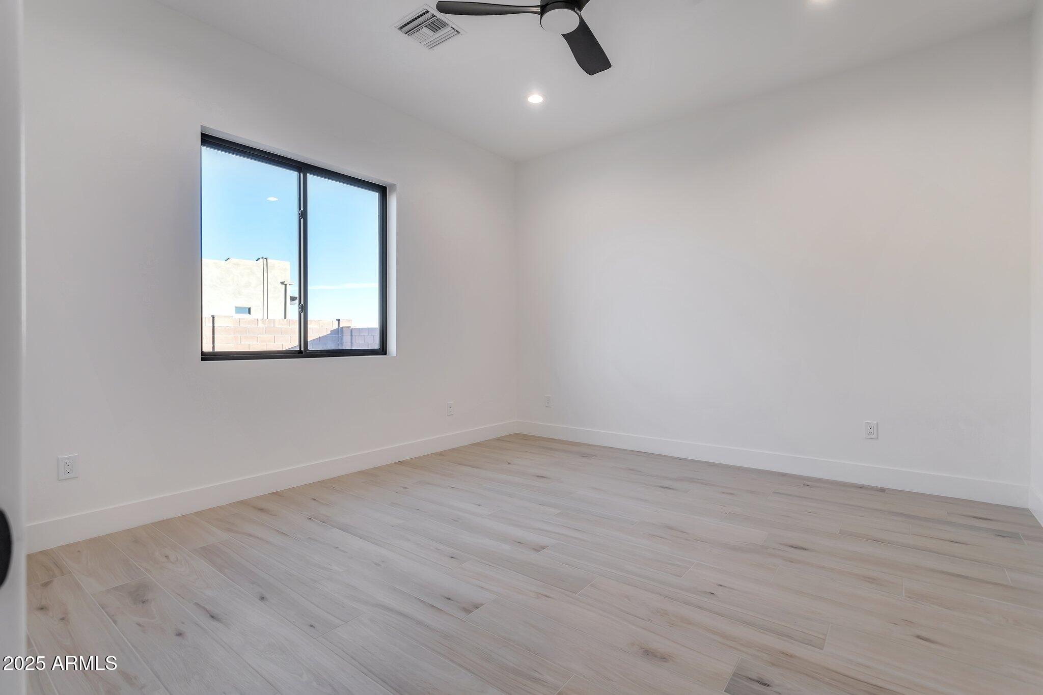 1602 East Cloud Road Phoenix, AZ 85086 - Photo 31 of 45 an empty room with a window