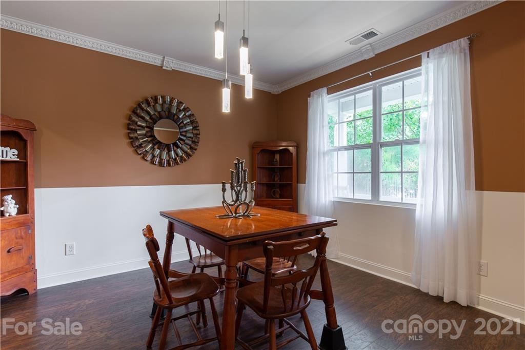 321 Allspice Road Fort Mill, SC 29708 - Photo 14 of 29 a view of a dining room with furniture window and wooden floor