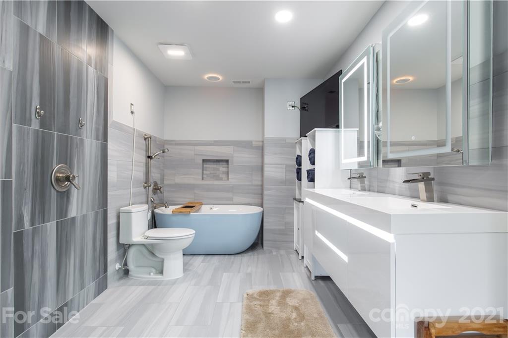 321 Allspice Road Fort Mill, SC 29708 - Photo 5 of 29 a large bathroom with a bathtub shower sink mirror and toilet