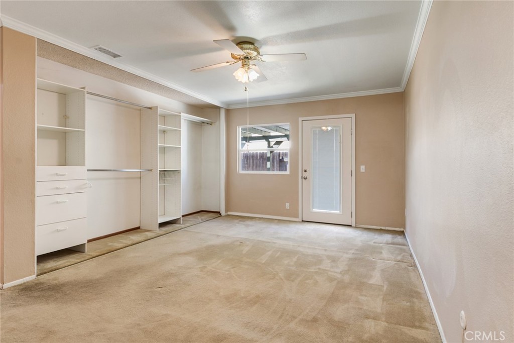 9130 Duncan Avenue Riverside, CA 92503 - Photo 20 of 34 an empty room with closet and ceiling fan