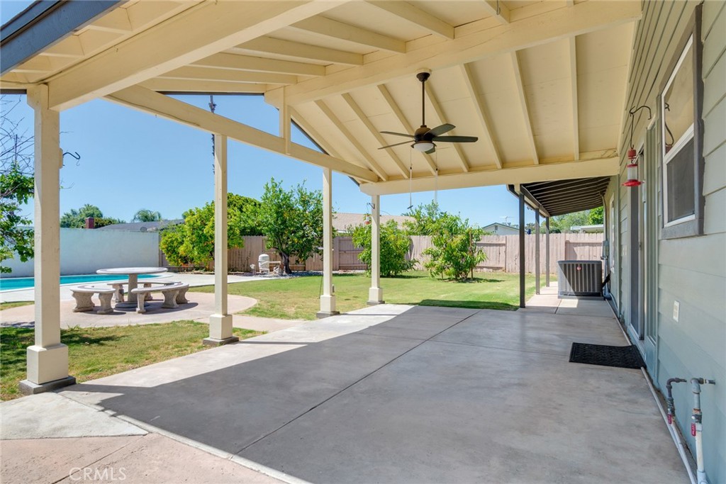 9130 Duncan Avenue Riverside, CA 92503 - Photo 25 of 34 a view of a backyard with table and chairs under an umbrella