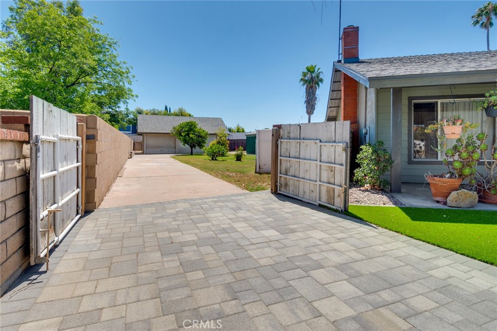9130 Duncan Avenue Riverside, CA 92503 - Photo 34 of 34 a view of a house with a yard and potted plants