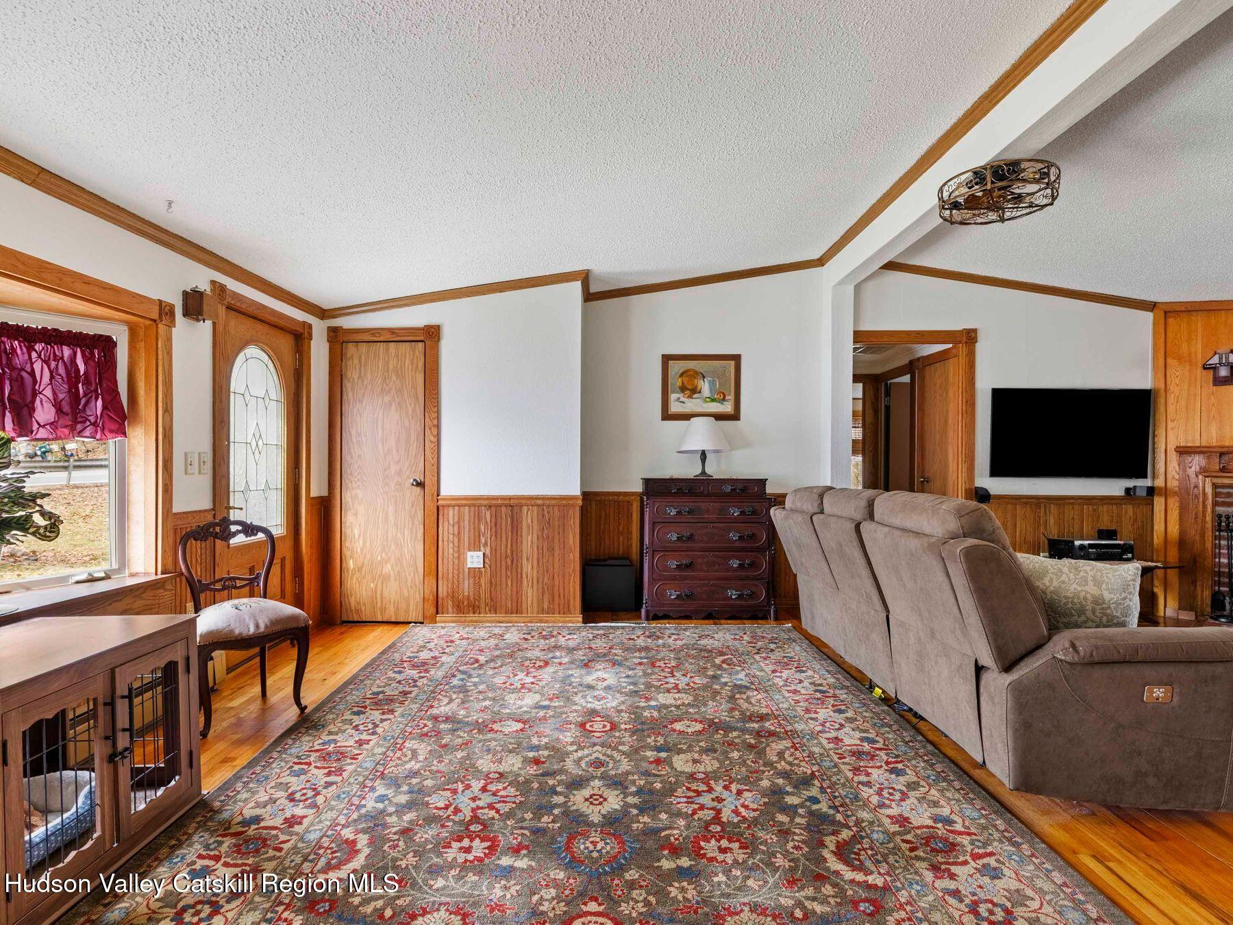 382 Cairo Junction Road Catskill, NY 12414 - Photo 16 of 38 a bedroom with furniture and a flat screen tv