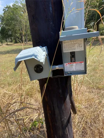 a view of a chairs and table in th patio