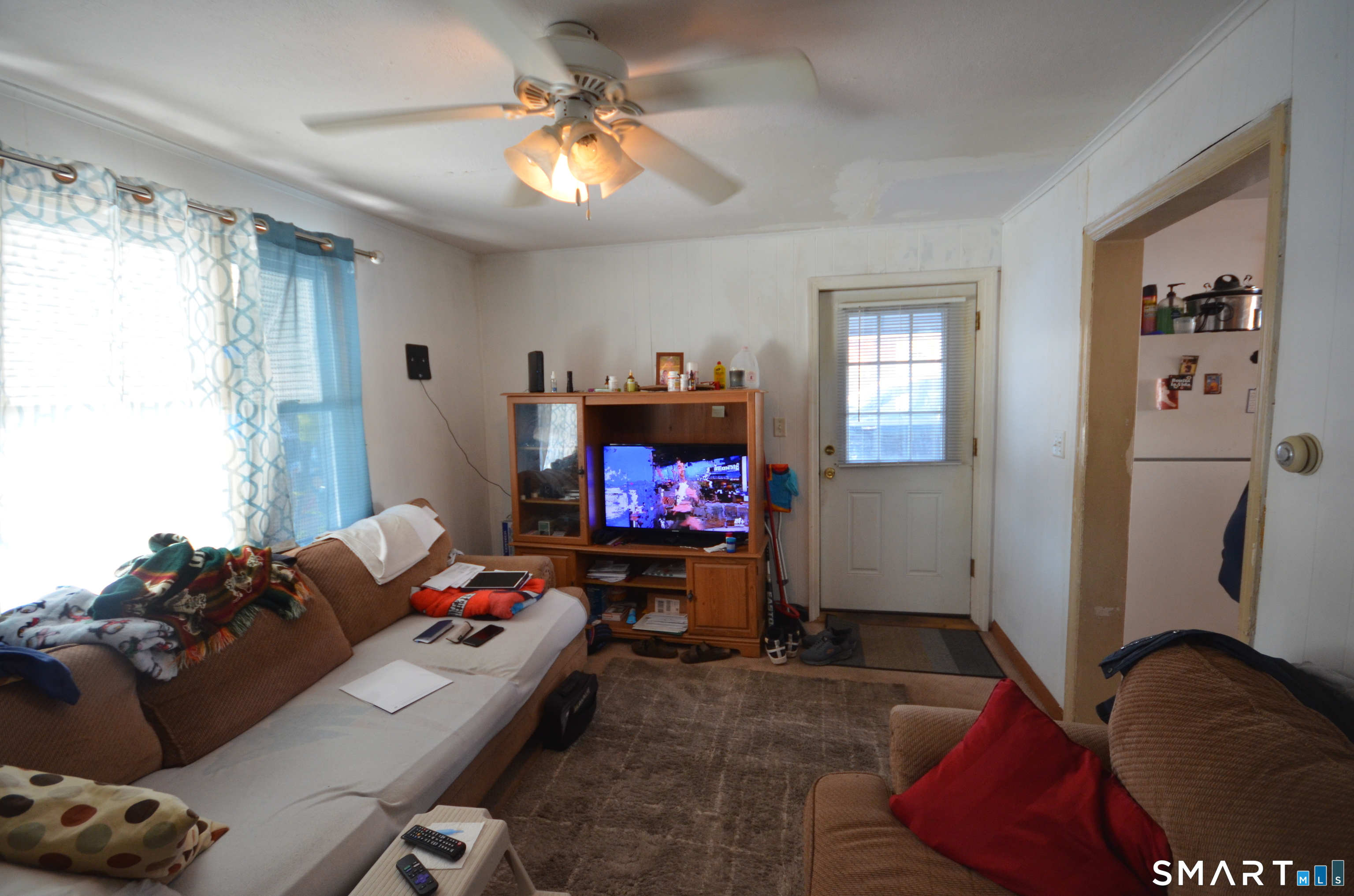 85 Alexander Drive Bridgeport, CT 06606 - Photo 11 of 24 a living room with furniture and a flat screen tv