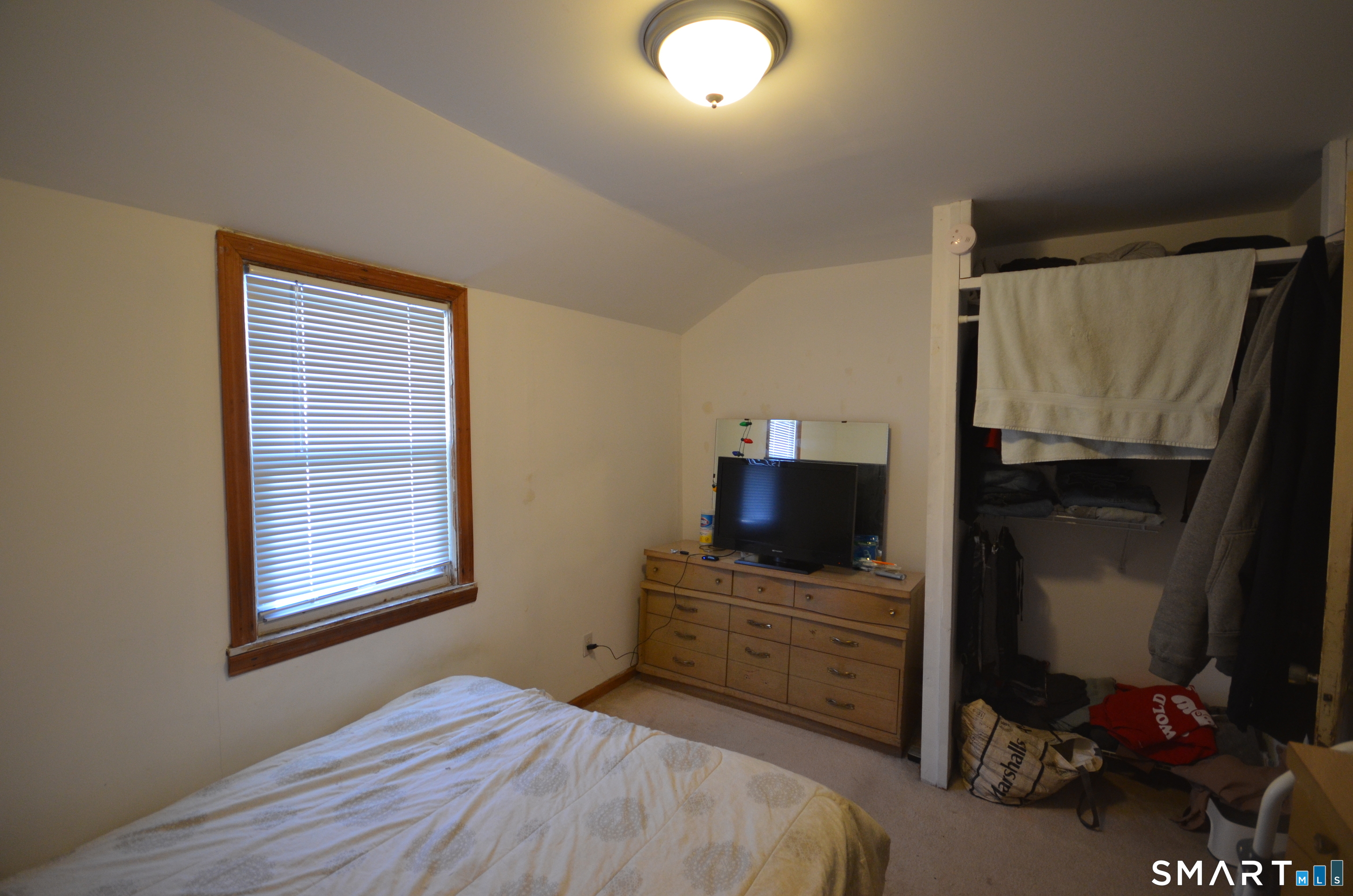 85 Alexander Drive Bridgeport, CT 06606 - Photo 17 of 24 a bedroom with a bed and a television