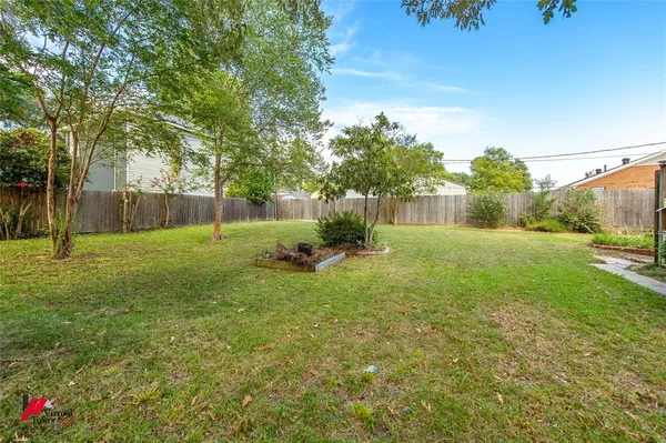 a backyard of a house with lots of green space