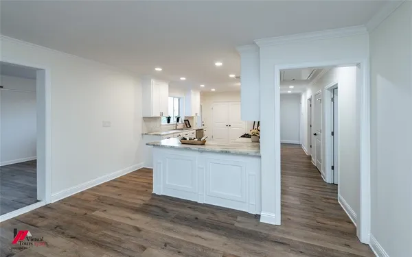 a view of kitchen with wooden floor
