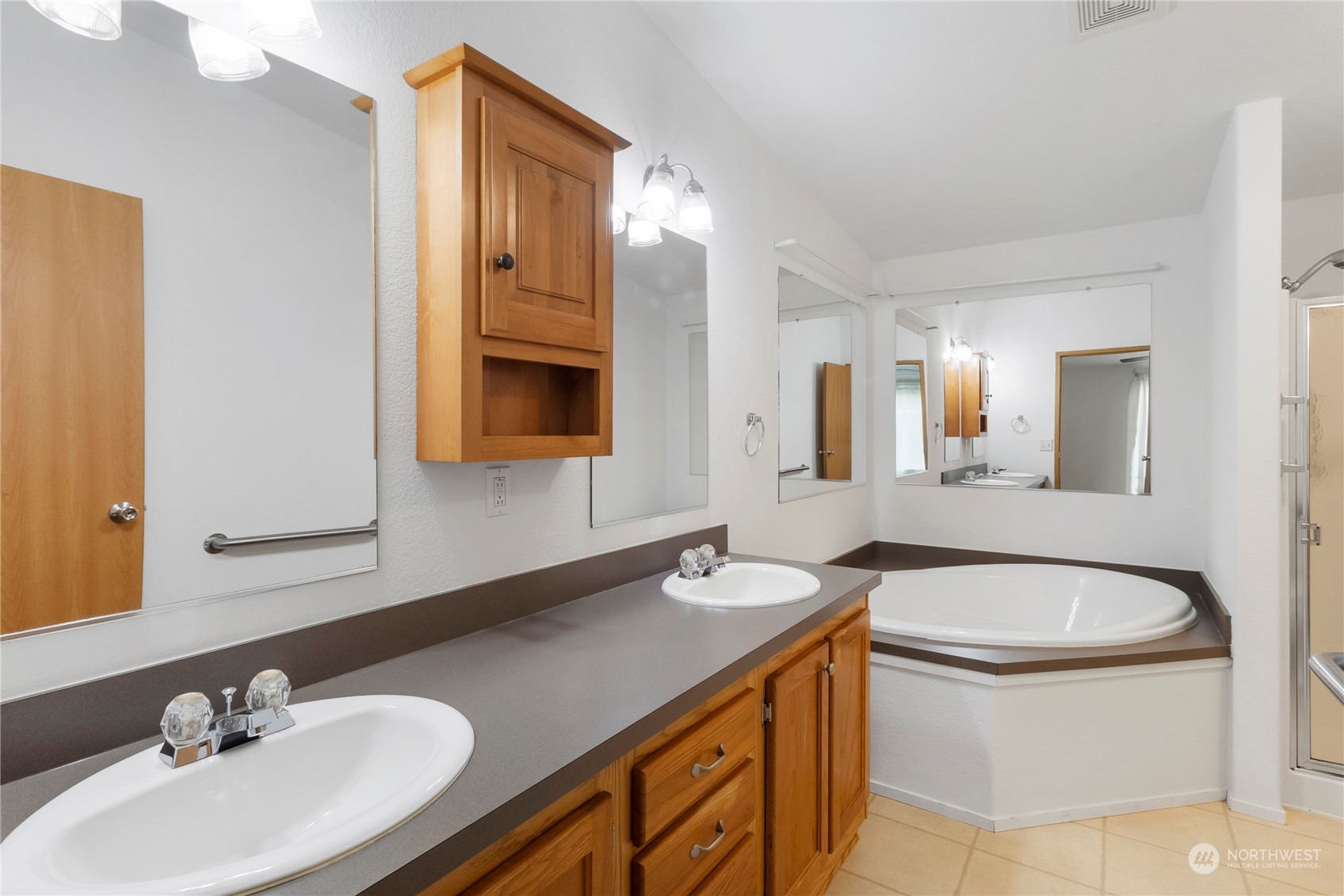 1208 Spruce Drive Enumclaw, WA 98022 - Photo 11 of 25 a bathroom with a sink and a mirror