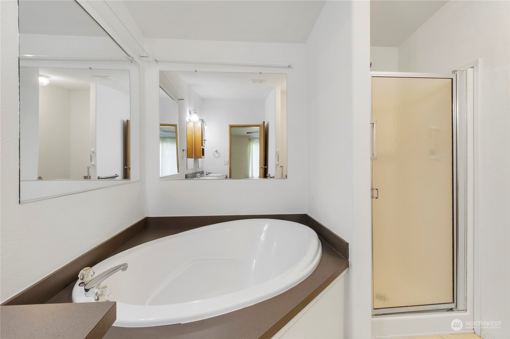 1208 Spruce Drive Enumclaw, WA 98022 - Photo 12 of 25 a bathroom with a bathtub and a mirror