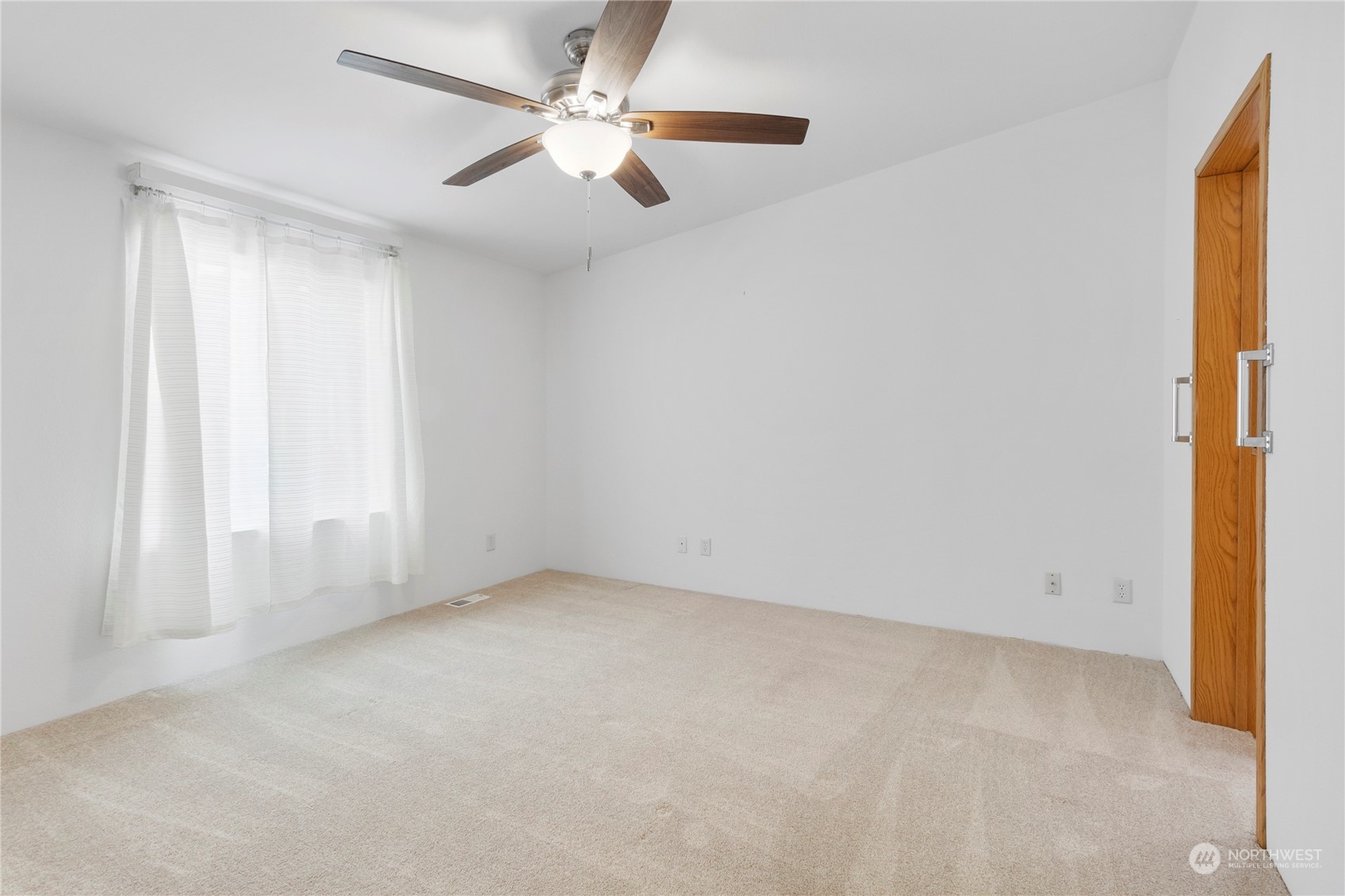 1208 Spruce Drive Enumclaw, WA 98022 - Photo 15 of 25 an empty room with a window and a fan