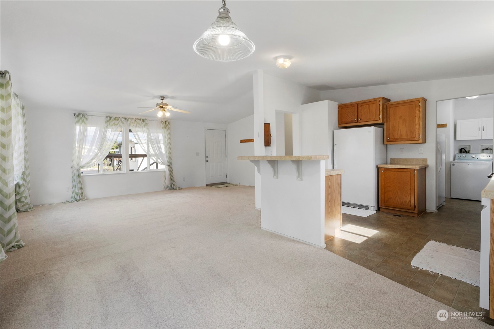 1208 Spruce Drive Enumclaw, WA 98022 - Photo 5 of 25 a view of a kitchen with furniture and a kitchen