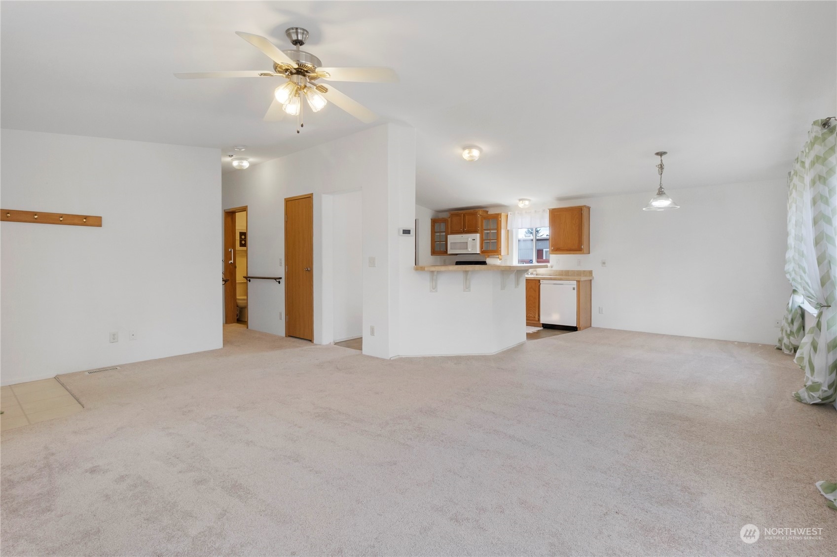 1208 Spruce Drive Enumclaw, WA 98022 - Photo 9 of 25 a view of a kitchen with a sink and a refrigerator