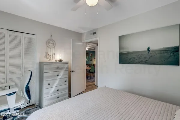 a bedroom with a bed and furniture