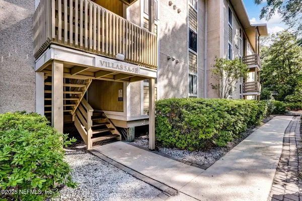 a front view of a building with garden