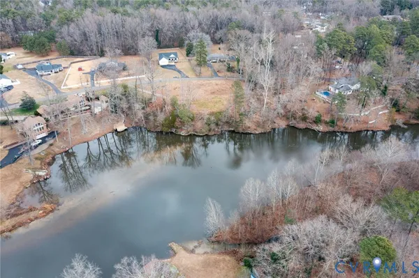 a view of a lake in middle of forest