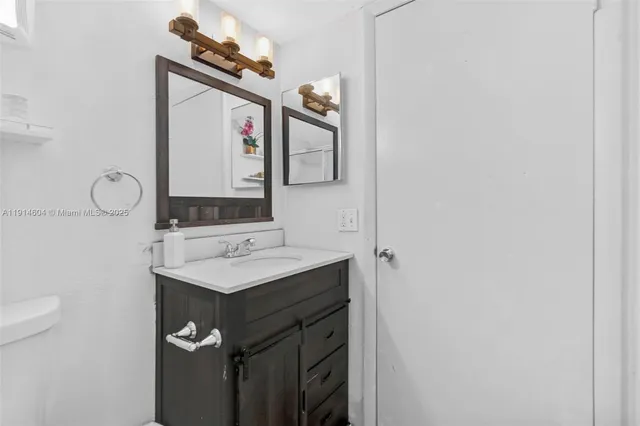 a view of a livingroom with furniture and a window