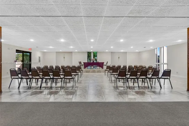 a view of a room with furniture and a projector