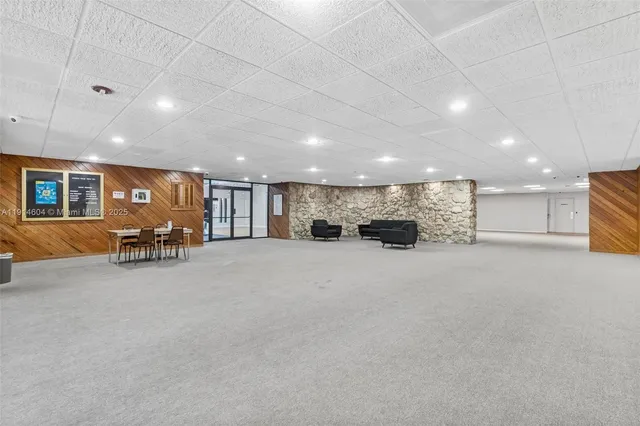 a kitchen with a table and chairs