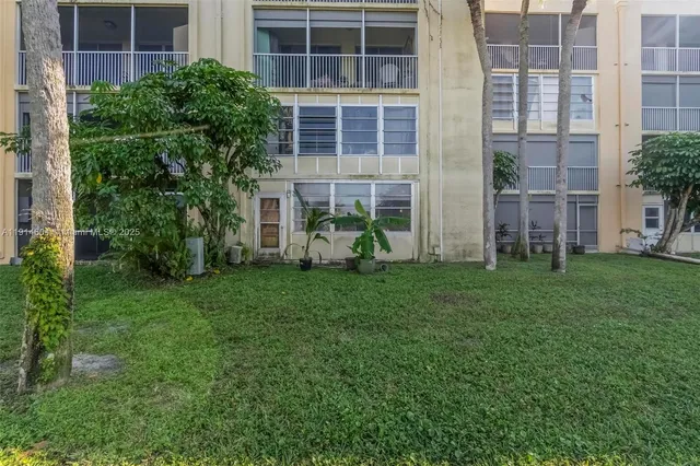 a view of a lake with houses in the back