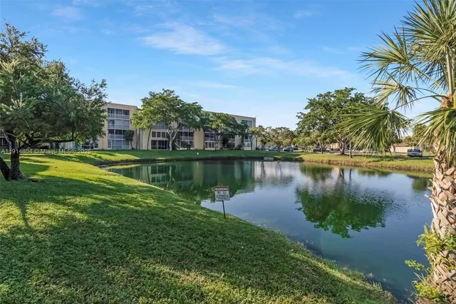 a garden with plants and lake view