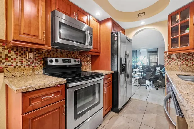 a kitchen with a stove and a microwave