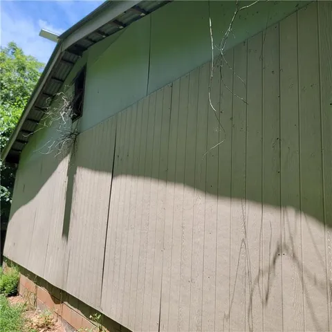 a backyard of a house with lots of green space