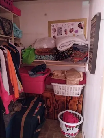 a bathroom with a toilet a sink and a mirror