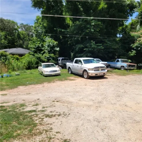 a view of a backyard with plants and a patio