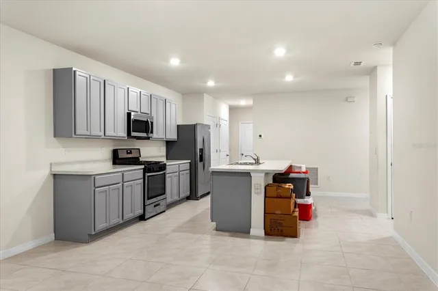 a kitchen with a sink and counter top space