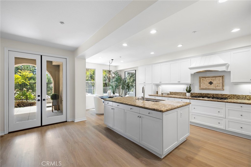 47 Tuscany Ladera Ranch, CA 92694 - Photo 7 of 28 a kitchen with granite countertop a sink and cabinets