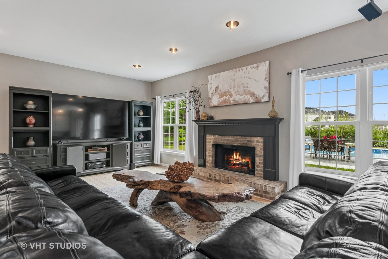 900 Legacy Ridge Algonquin, IL 60102 - Photo 14 of 41 a living room with furniture a large window and a fireplace