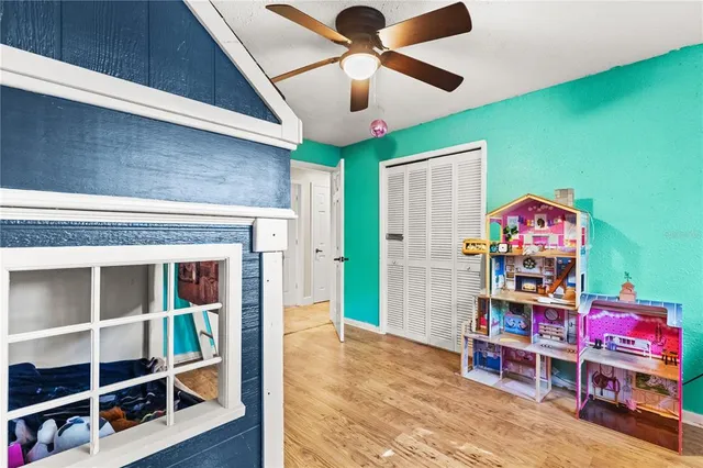 a view of a room with shelves and wooden floor