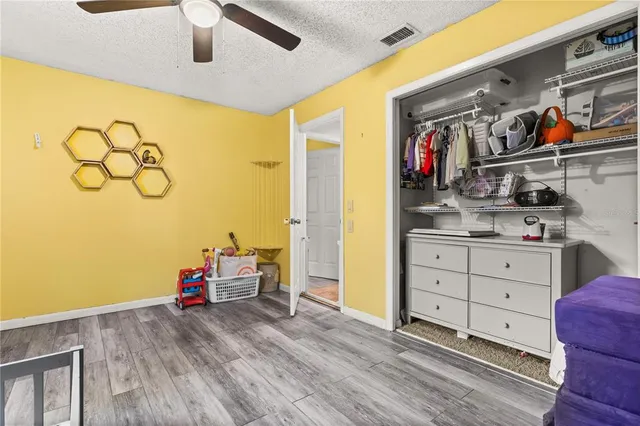 a bedroom with a bed and a closet