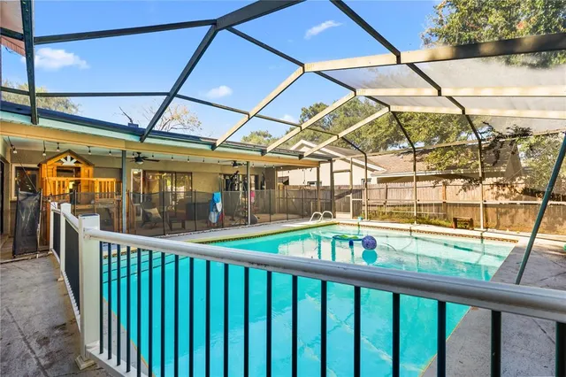 a view of a balcony with a swimming pool