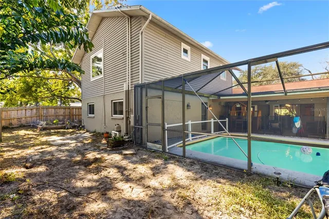 a view of a house with a yard and sitting area