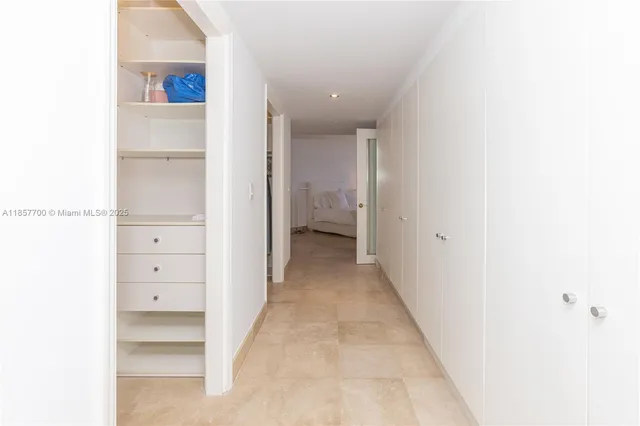 a spacious bedroom with a bed and window