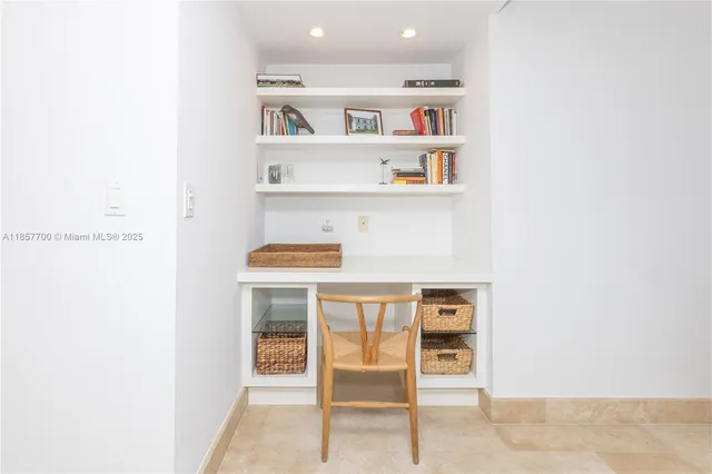a bedroom with a bed and a tv on the dresser