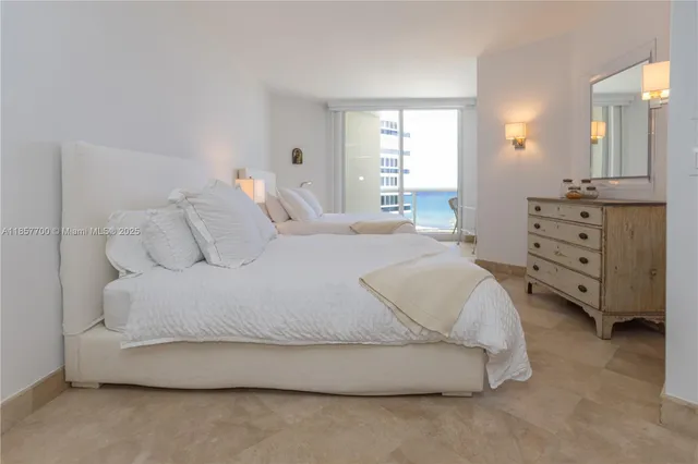 a bedroom with a bed and a television in it