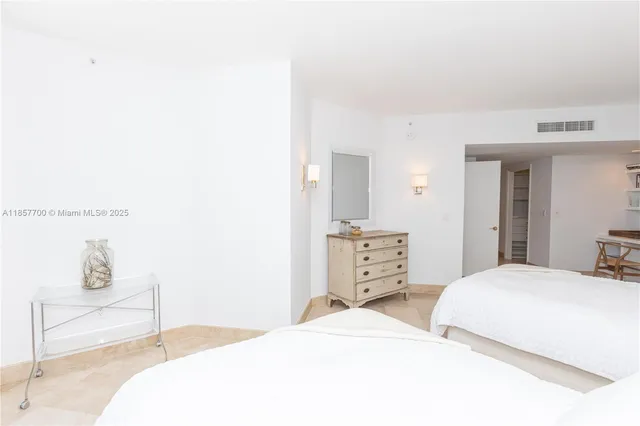 a spacious bathroom with a double vanity sink and a mirror