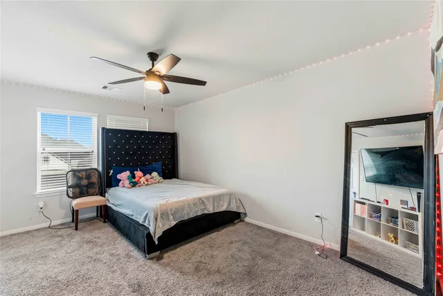 a bedroom with a bed and a fireplace