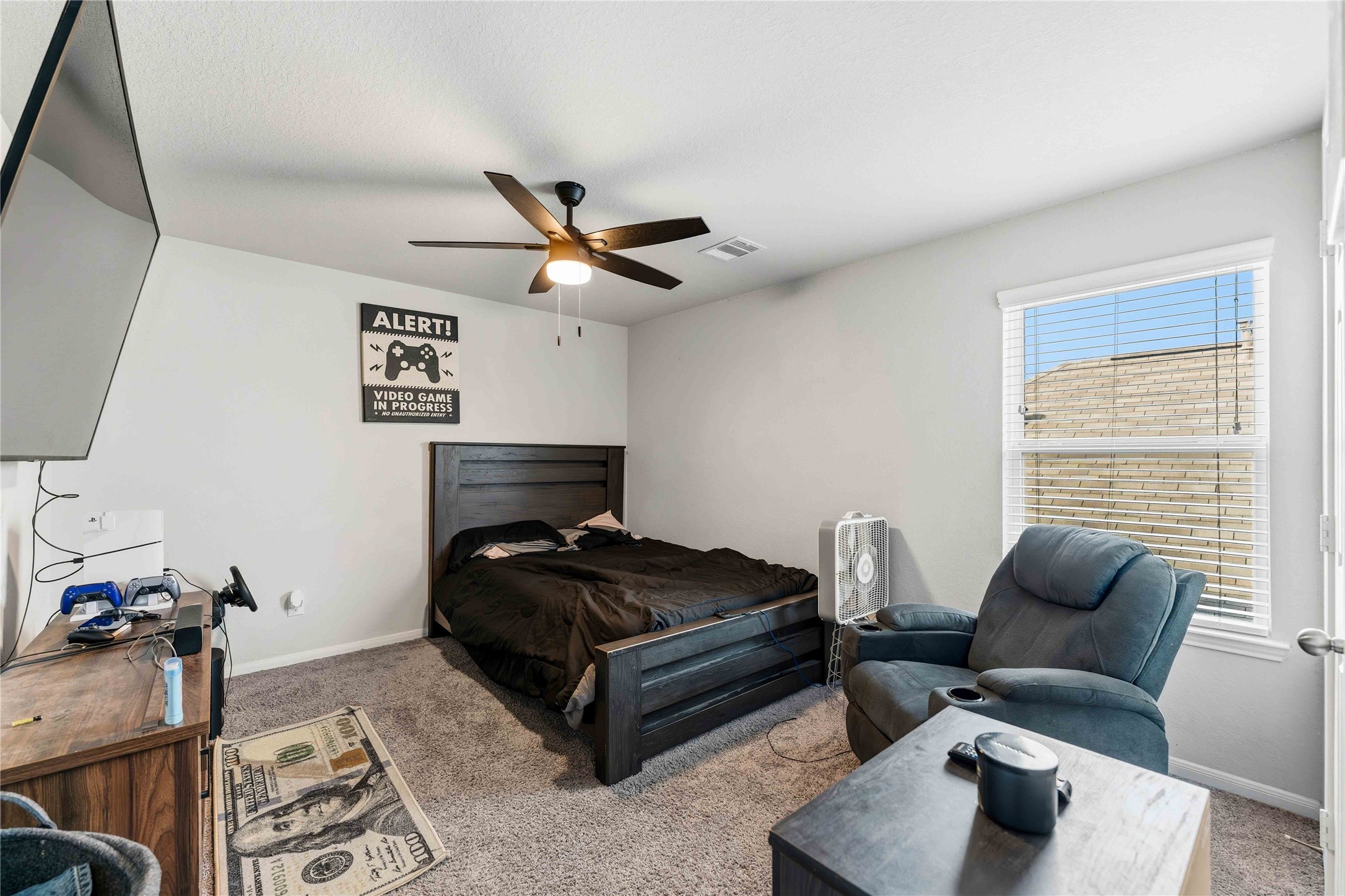 14810 Ruddy Duck Lane Houston, TX 77049 - Photo 14 of 28 a bedroom with a bed and a couch