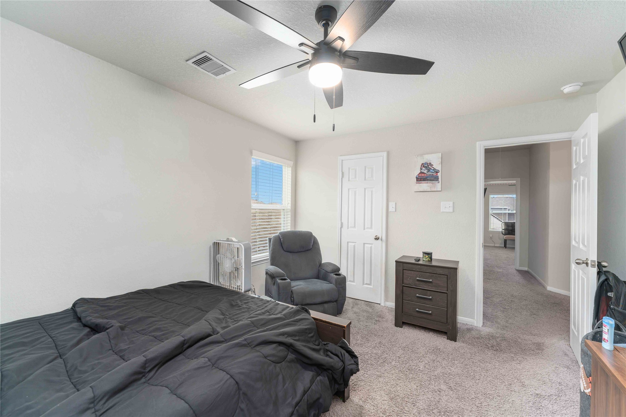 14810 Ruddy Duck Lane Houston, TX 77049 - Photo 15 of 28 a bedroom with furniture and a ceiling fan