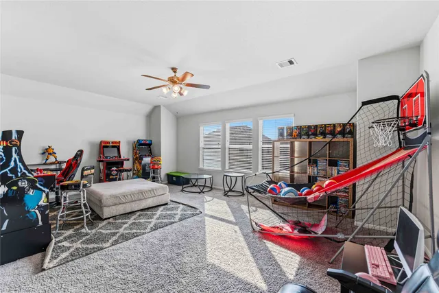 a living room with lots of furniture and a flat screen tv