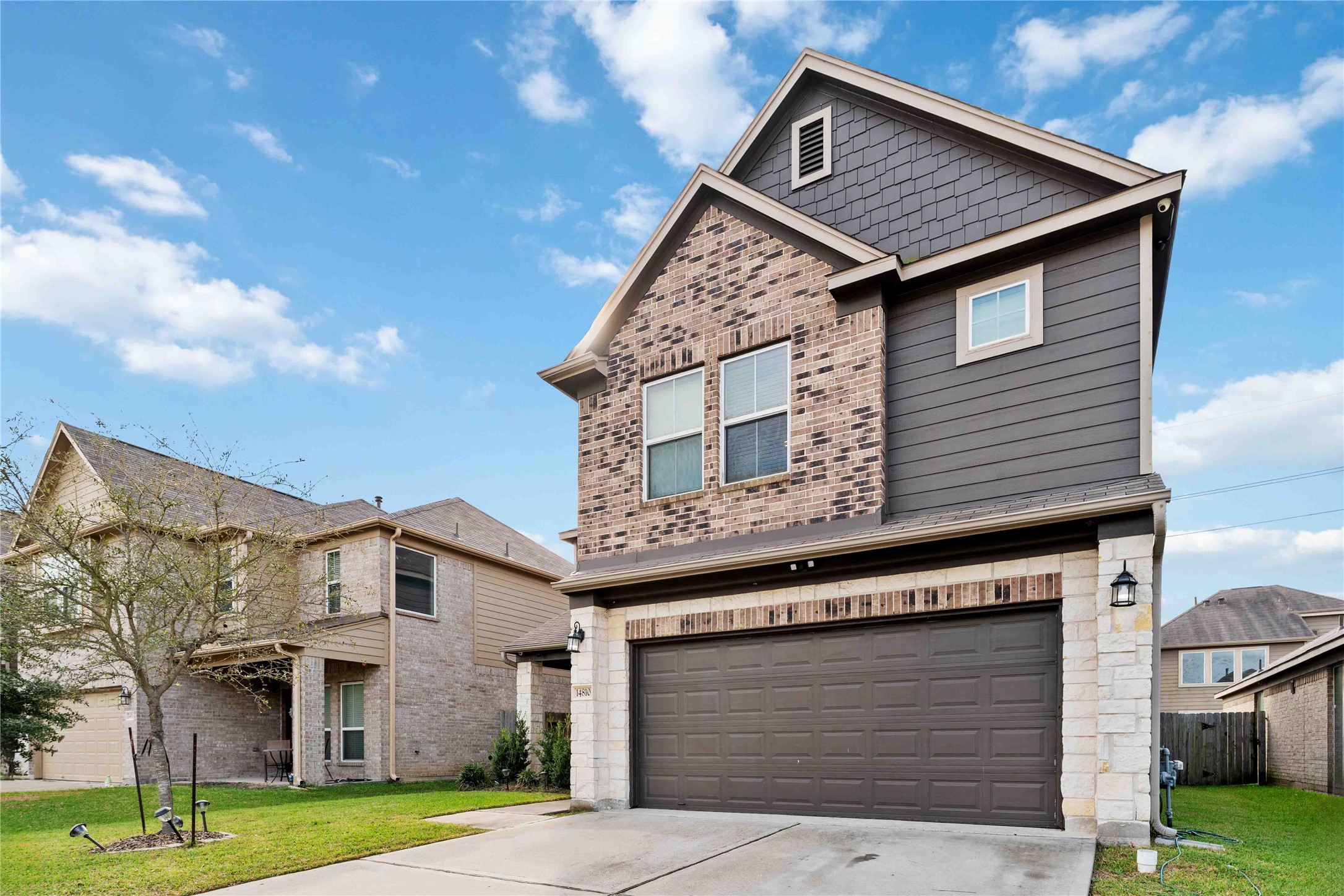 14810 Ruddy Duck Lane Houston, TX 77049 - Photo 2 of 28 a front view of a house with garden