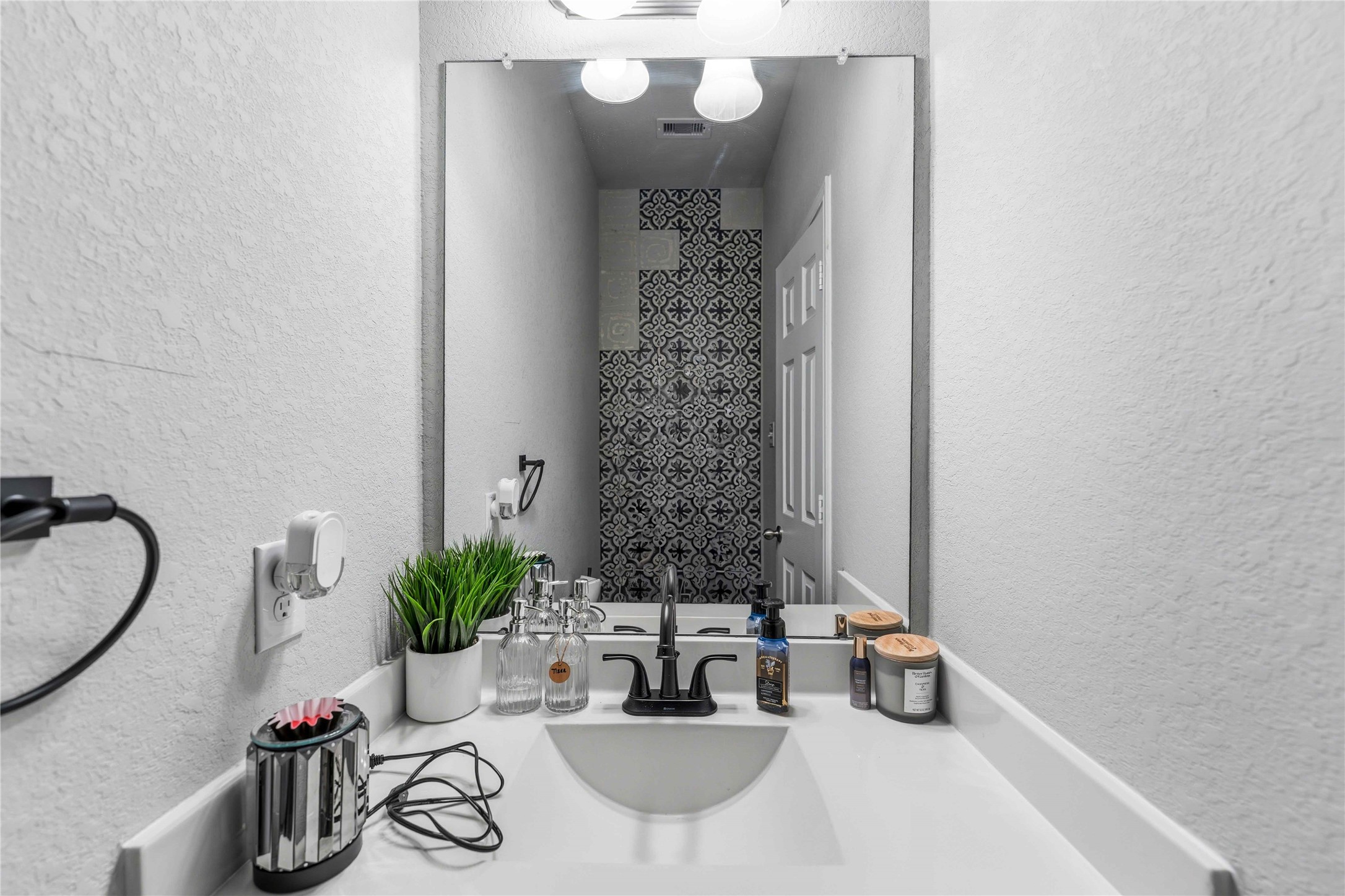 14810 Ruddy Duck Lane Houston, TX 77049 - Photo 22 of 28 a bathroom with a sink and a mirror