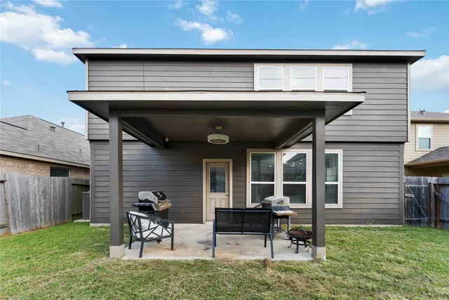 a view of an chairs and table in patio