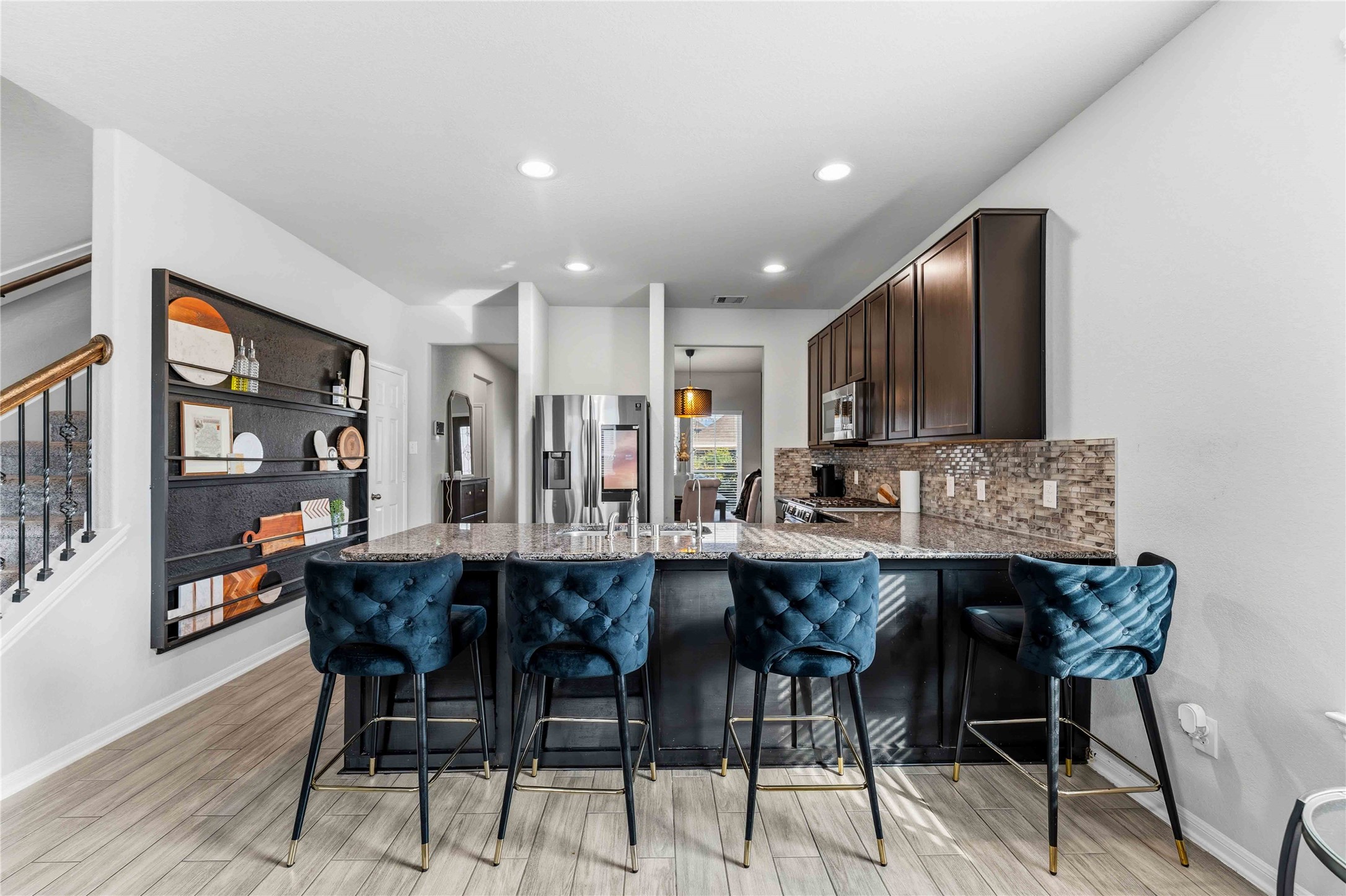 14810 Ruddy Duck Lane Houston, TX 77049 - Photo 4 of 28 a dining area with stainless steel appliances a table and chairs