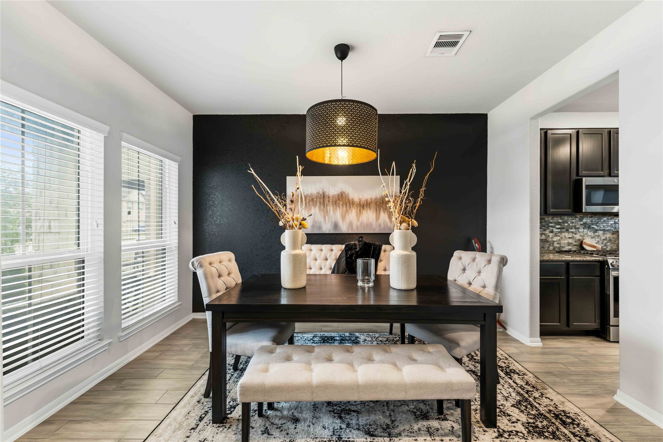 14810 Ruddy Duck Lane Houston, TX 77049 - Photo 7 of 28 a view of a dining room with furniture and wooden floor